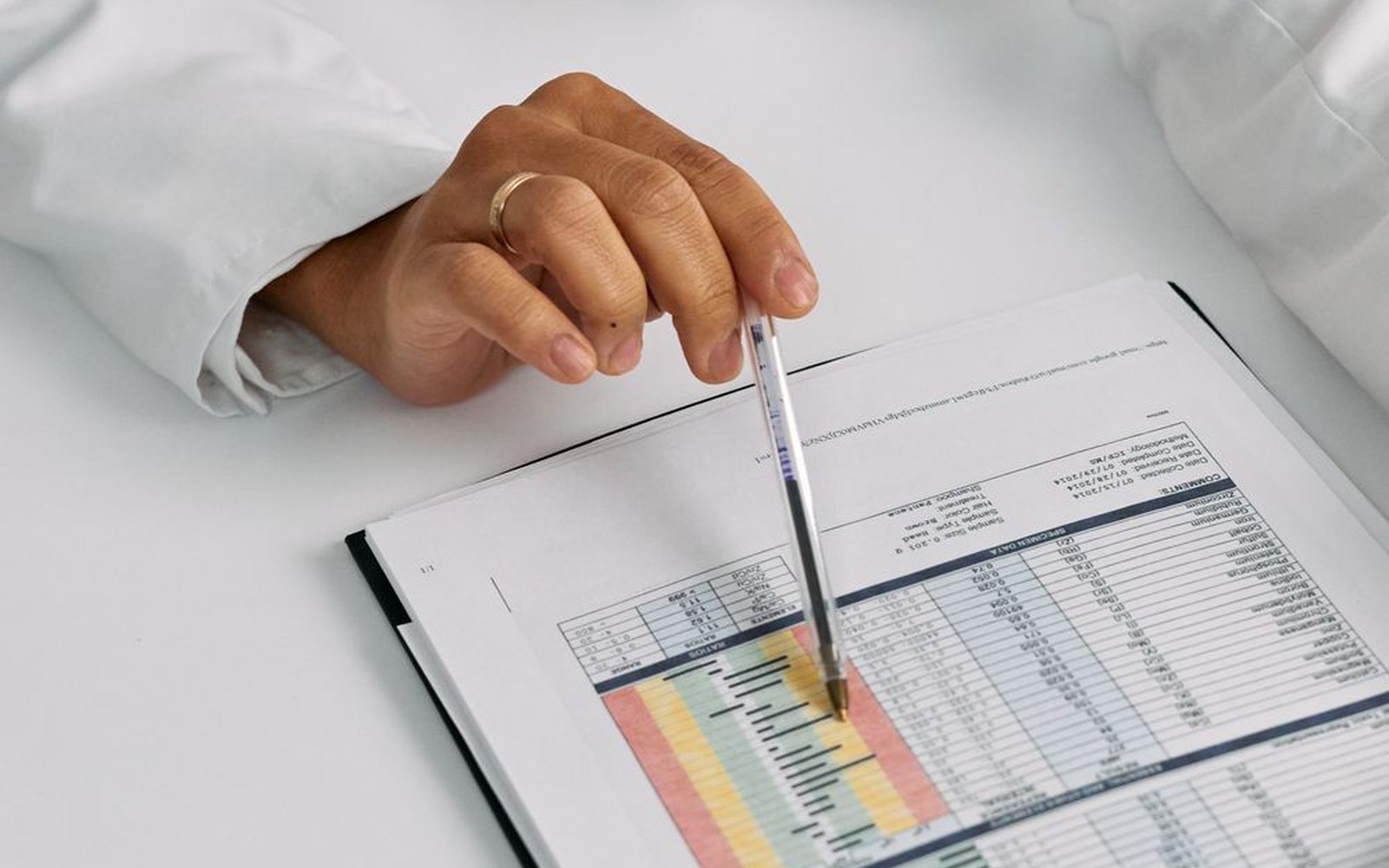 Medical professional reviewing cost and planning documents